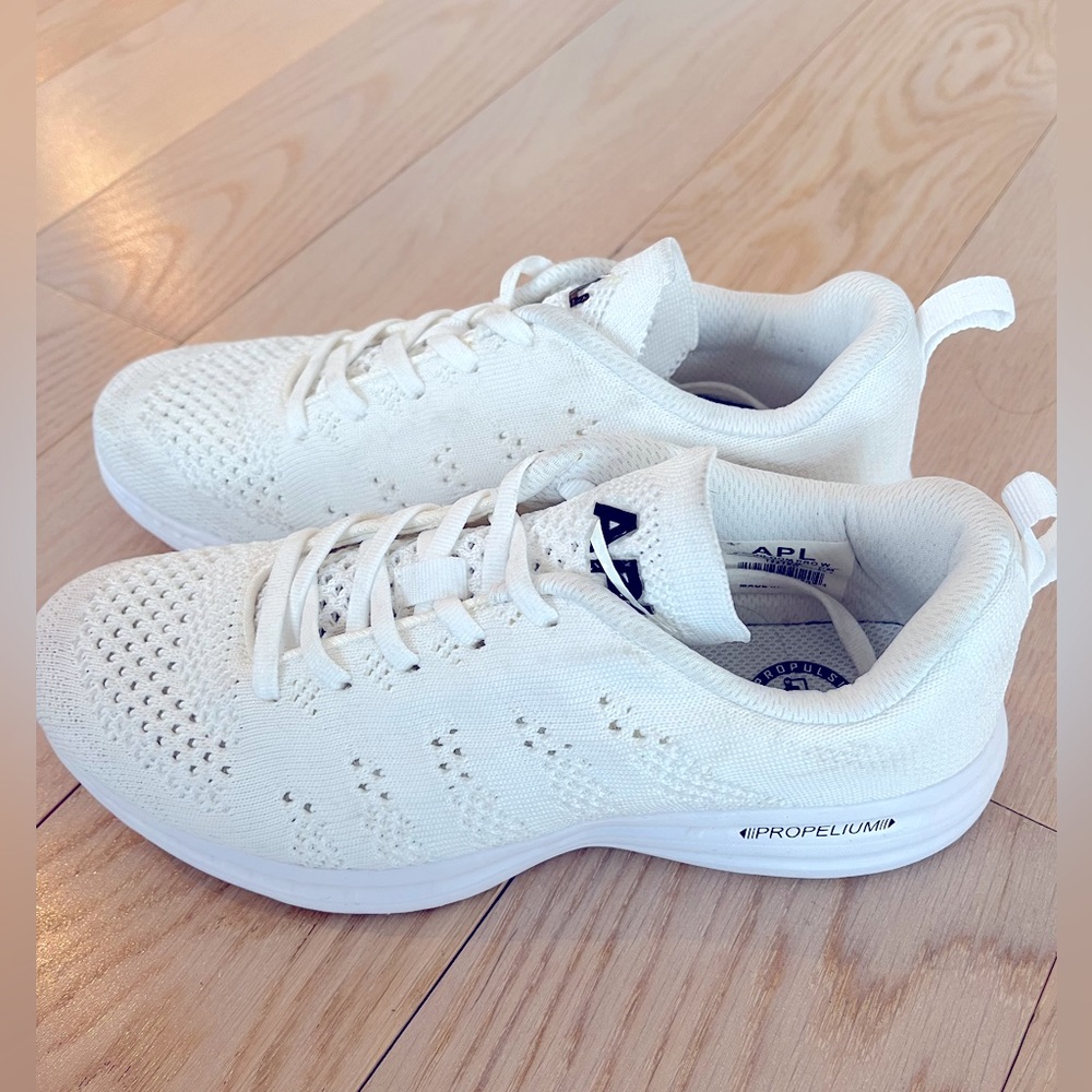Size 8 women’s APL TechLoom Pro running shoe, white, worn once.